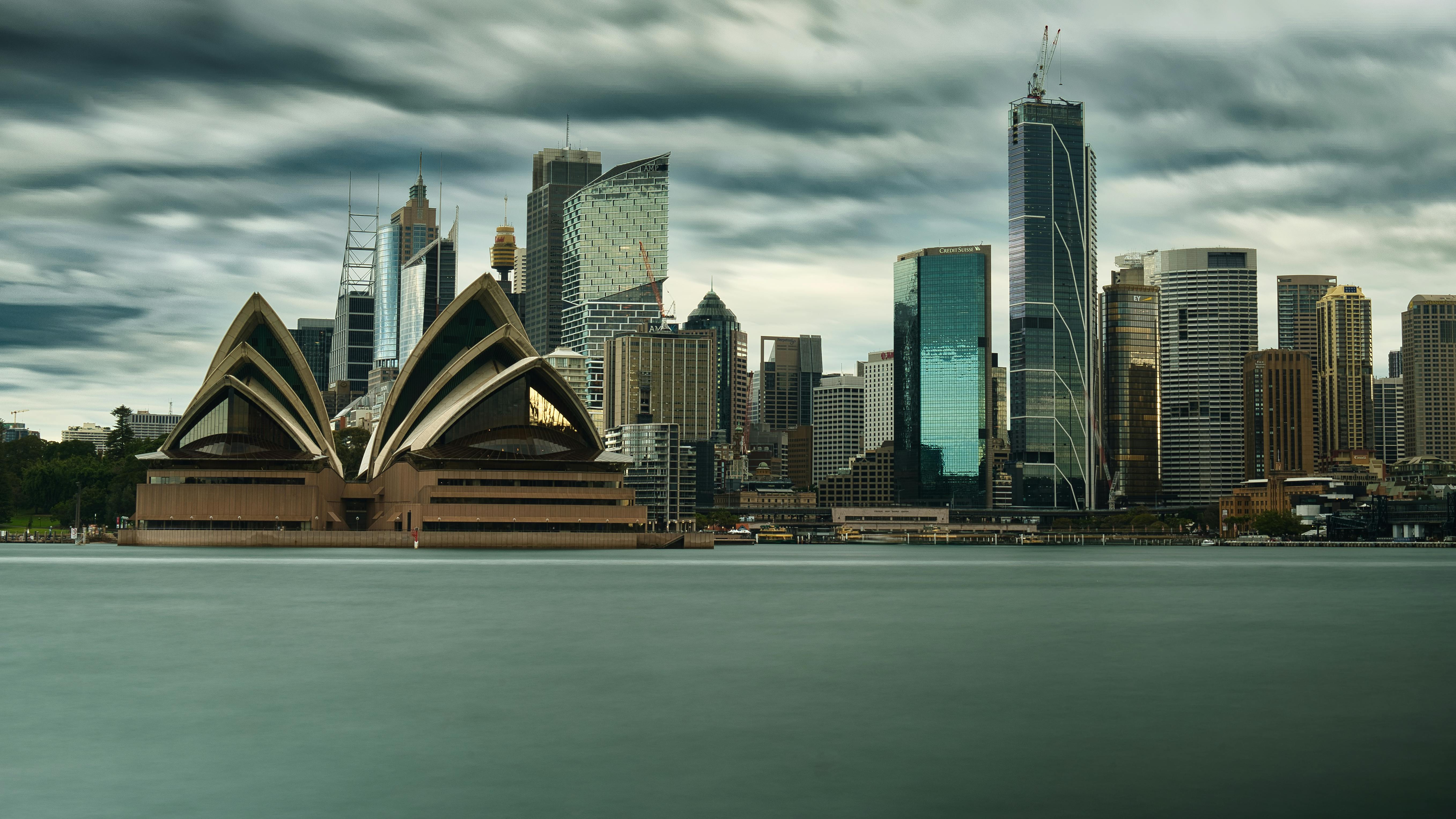 Sydney harbour and CBD skyline under heavy cloud - the jurisdiction in which the October 2025 NSW WHS reforms apply